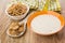 Yogurt in bowl, napkin, flakes in spoon, in bowl