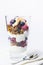 Yogurt dessert with granola, blueberry, raspberry and chocolate on the top