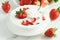 Yogurt with fresh strawberries in a bowl like breakfast and snack close up