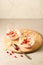 yogurt with garnet grains and flakes in glass/yogurt with garnet grains and flakes in glass on a wooden tray and white stone