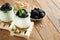 Yogurt with granola, blackberry berry fruits and muesli served in glass jar on wooden background. Healthy breakfast concept. Healt