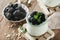 Yogurt with granola, blackberry berry fruits and muesli served in glass jar on wooden background. Healthy breakfast concept. Healt