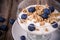 Yogurt with granola and blueberries.