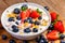 Yogurt with granola, strawberries and blueberries.