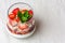 Yogurt with muesli and strawberries for healthy breakfast or snack. Strawberry dessert parfait with yogurt and granola.