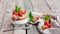 Yogurt with muesli and strawberries for healthy breakfast or snack. Strawberry dessert parfait with yogurt and granola.