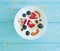 Yogurt,natural oatmeal, strawberries, blueberries on a wooden background