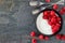 Yogurt with raspberries, top view, side border on a slate background