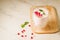 Yogurt. Yogurt with garnet and mint in glass on a wooden tray and the scattered pomegranate seeds on a white marble table. Copy