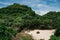 Yogyakarta, Indonesia - January 1, 2022: View from the top of ngetun beach, Gunungkidul.  White sandy beach surrounded by trees