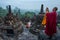 Yogyakarta, Indonesia - March 17, 2018: Monk makes photos at Borobudur temple sunrise in Yogyakarta