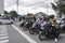 Yogyakarta, Indonesia - November 5th 2022: A portrait of bikers obeys traffic rules by stopping when it red lights
