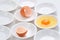 Yolks in small bowls by circle shape repetition in white backgr