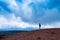 Yong woman enjoying unearthly landscape of Etna volcano, Sicily