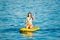 Yong Woman on a Yellow Sup Paddle Board