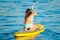 Yong Woman on a Yellow Sup Paddle Board