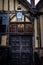 YORK, ENGLAND, DECEMBER 12, 2018: Yorkshire`s Merchant Adventurers Hall wooden doorstep and old lantern with its logo