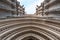 York England UK. View of the entrance to York Minster, looking up towards the sky. Photo shows details of the stone carvings.