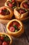 Yorkshire puddings stuffed with sausages close-up. Vertical