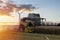 Yorkshire, UK - July 16, 2022 New Holland. Wheat harvesting in the summer season by a modern combine harvester. Farmers securing