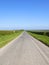 Yorkshire wolds road with hedgerows and green verges