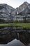 Yosemite Falls and reflection on Merced River, El Capitan Meadow, California