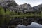 Yosemite Falls and reflection on Merced River, El Capitan Meadow, California