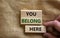 You belong here symbol. Wooden blocks with words \'You belong here\'