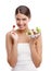 You cant go wrong with a salad. Portrait of a beautiful young woman standing with a bowl of salad against a white
