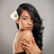 You are capable of amazing things. a beautiful young woman posing with a flower in her hair.