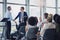 You deserve it. two businessmen shaking hands during a seminar in the conference room.