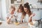 You do it good, keep mixing. Mother, grandmother and daughter having good time in the kitchen