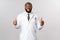 You are fine, just follow prescription. Cheerful african-american male doctor, physician show thumbs-up and smiling