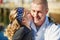 You give the best little kisses. a father in a navy uniform bonding with his little girl on the dock.