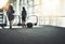 You gotta go where business calls. Rearview shot of two unrecognizable businesswomen going on an escalator in a modern