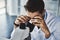 You have to look closely to see the bigger picture. a scientist using a microscope in a lab.