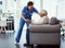 You look comfortable. Full length shot of a young female nurse helping her senior patient up from a chair in the old age