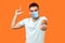 You are loser! Portrait of bossy angry man with medical mask in white t-shirt showing loser gesture and pointing at camera,