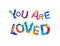 You are loved. Inscription of splash paint letters