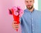 This is for you Macho gives flowers as romantic gift. Boyfriend confident holds bouquet flowers. Guy bring romantic