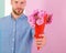 This is for you Macho gives flowers as romantic gift. Boyfriend confident holds bouquet flowers. Guy bring romantic