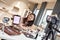 You need it. Beauty blogger woman filming, advertising app on camera, holding tablet pc. Makeup influencer asian girl