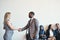 Are you ready for the interview. Shot of a cheerful young business receiving a handshake from a businesswoman while