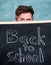 Are you ready study. Teacher or school principal behind inscription back to school. Teacher peeking out of blackboard
