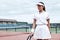 Are you ready to lose? Beautiful girl is going to play tennis on the court