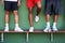 Are you ready to step up your game. Closeup shot of a group of sporty men standing on a bench against a wall.