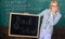 Are you ready to study. Beginning of new school season. Woman teacher holds blackboard inscription back to school. Lady