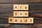 Are You Ready word written on wood block. Are You Ready text on table, concept