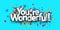 You are wonderful sign over colorful cut out ribbon confetti background