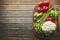 You wont find anything fresher. a variety of fresh produce on a wooden chopping board.